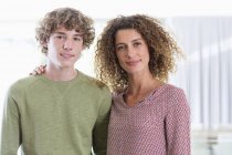Portrait of happy mother and son at home — Stock Photo