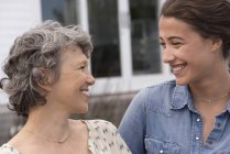 Close-up of happy mother looking at smiling daughter — Stock Photo