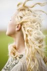 Portrait of young blond woman outdoors — Stock Photo