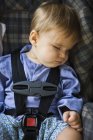 Close-up of baby boy sleeping in baby seat — Stock Photo