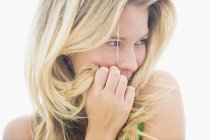 Close-up of blond woman smiling and looking away — Stock Photo