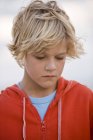 Close-up of thoughtful blonde boy looking down — Stock Photo