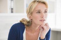 Close-up of blond thoughtful woman looking away — Stock Photo