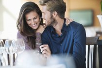 Man with engagement ring proposing girlfriend in restaurant — Stock Photo