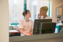 Two female nurses working in office — Stock Photo