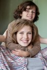Portrait of a woman smiling with his son — Stock Photo