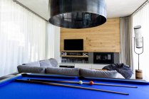 Pool table in modern living room — Stock Photo