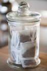 Teabags in jar at kitchen, selective focus — Stock Photo