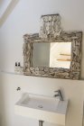 Interior of modern elegant bathroom with designed mirror — Stock Photo