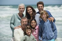 Portrait of happy multi-generation family on beach — Stock Photo