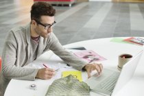 Male fashion designer working in office — Stock Photo