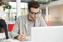 Male fashion designer working in office — Stock Photo