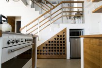 Interiors of modern kitchen in studio apartment — Stock Photo