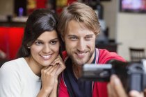Couple filming themselves with home video camera — Stock Photo
