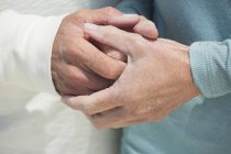 Close-up of couple holding hands together — Stock Photo