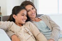 Portrait of a woman and her daughter smiling — Stock Photo