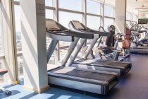 Exercise machines in gym, selective focus — Stock Photo