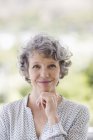 Portrait of smiling mature woman outdoors — Stock Photo