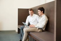 Two businessmen working in an office — Stock Photo
