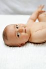 8 months baby boy lying down — Stock Photo