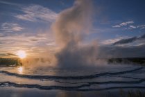 Splashing geyser at sunset, Yellowstone National Park, Wyoming, United States of America, North America — Stock Photo