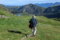France, Ariege, Pyrenees, backpacker rambling near peak Ruhle — Stock Photo