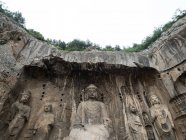 Testa di Vairocana Bouddha statua in grotte Longmen, Luoyang, Henan, Cina — Foto stock