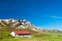 France, Savoie, a refuge in the mountain pastures and glaciers at the col des saisies — Stock Photo