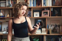 Teenage girl and everyday life. phone. Reading — Stock Photo