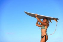 Beautiful surfer over sky — Stock Photo