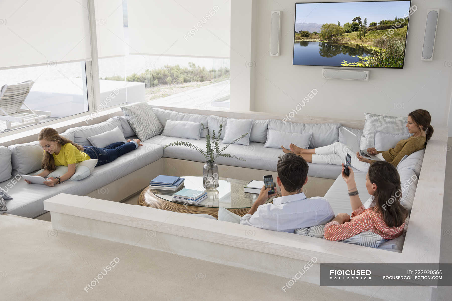 Multi Generation Family Using Gadgets, Living Room And Family