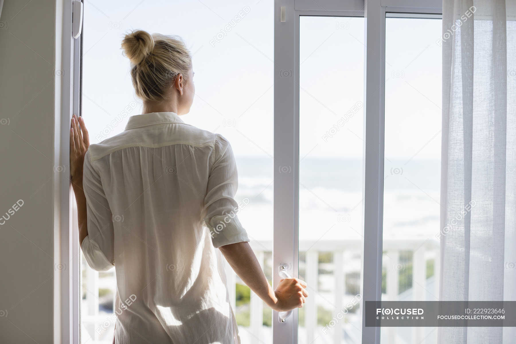 Девушка у окна. Человек открывает окно. Ребенок спиной у окна. Открытое пластиковое окно. She is standing the window.