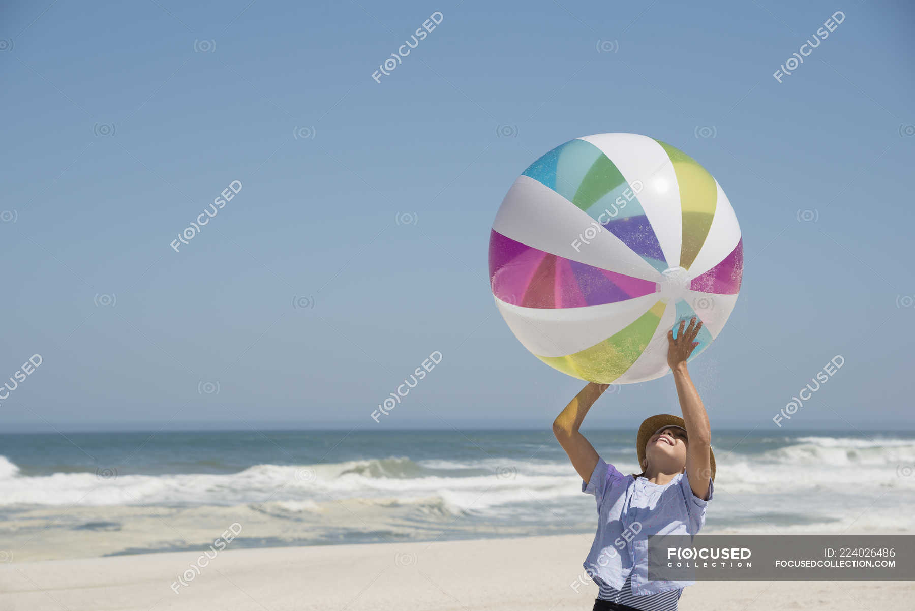 Girl playing on beach with colorful ball — caucasian ethnicity, wave ...