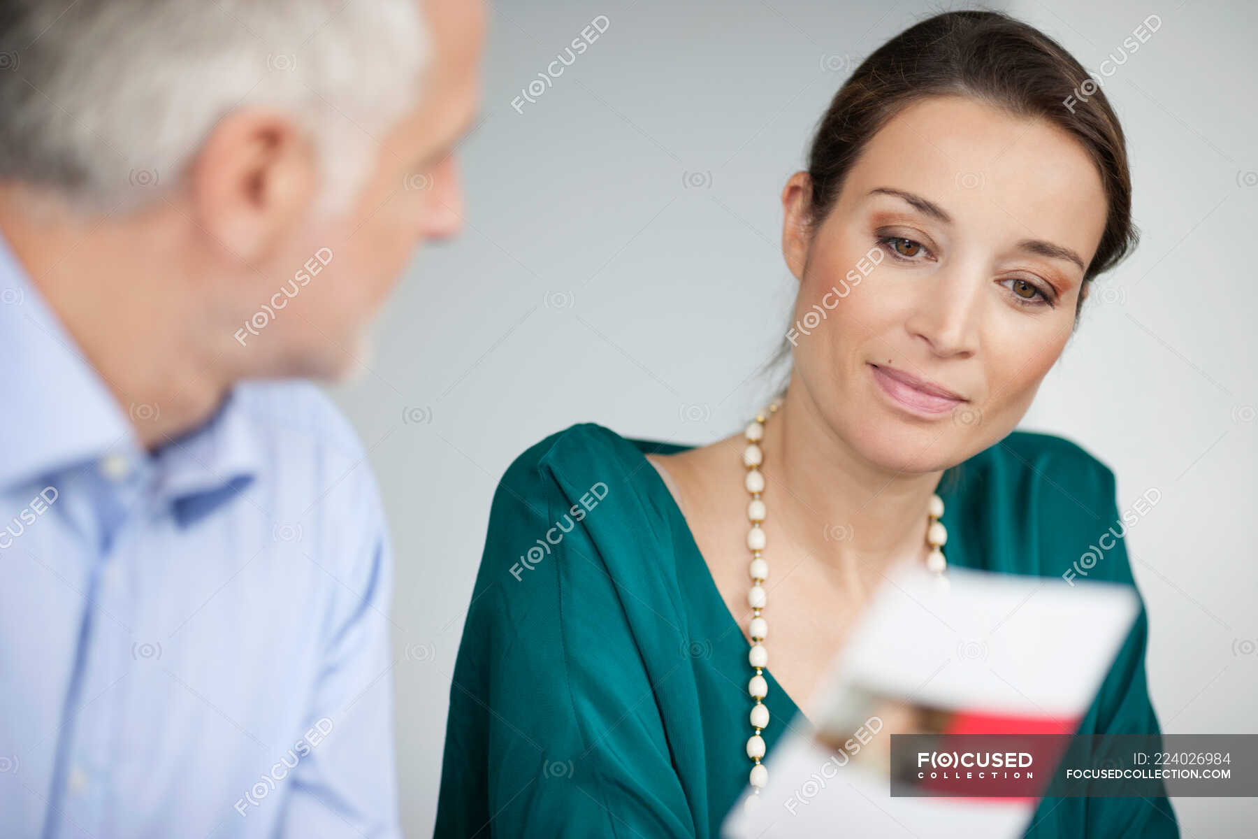 business-executives-discussing-in-an-office-holding-looking-away