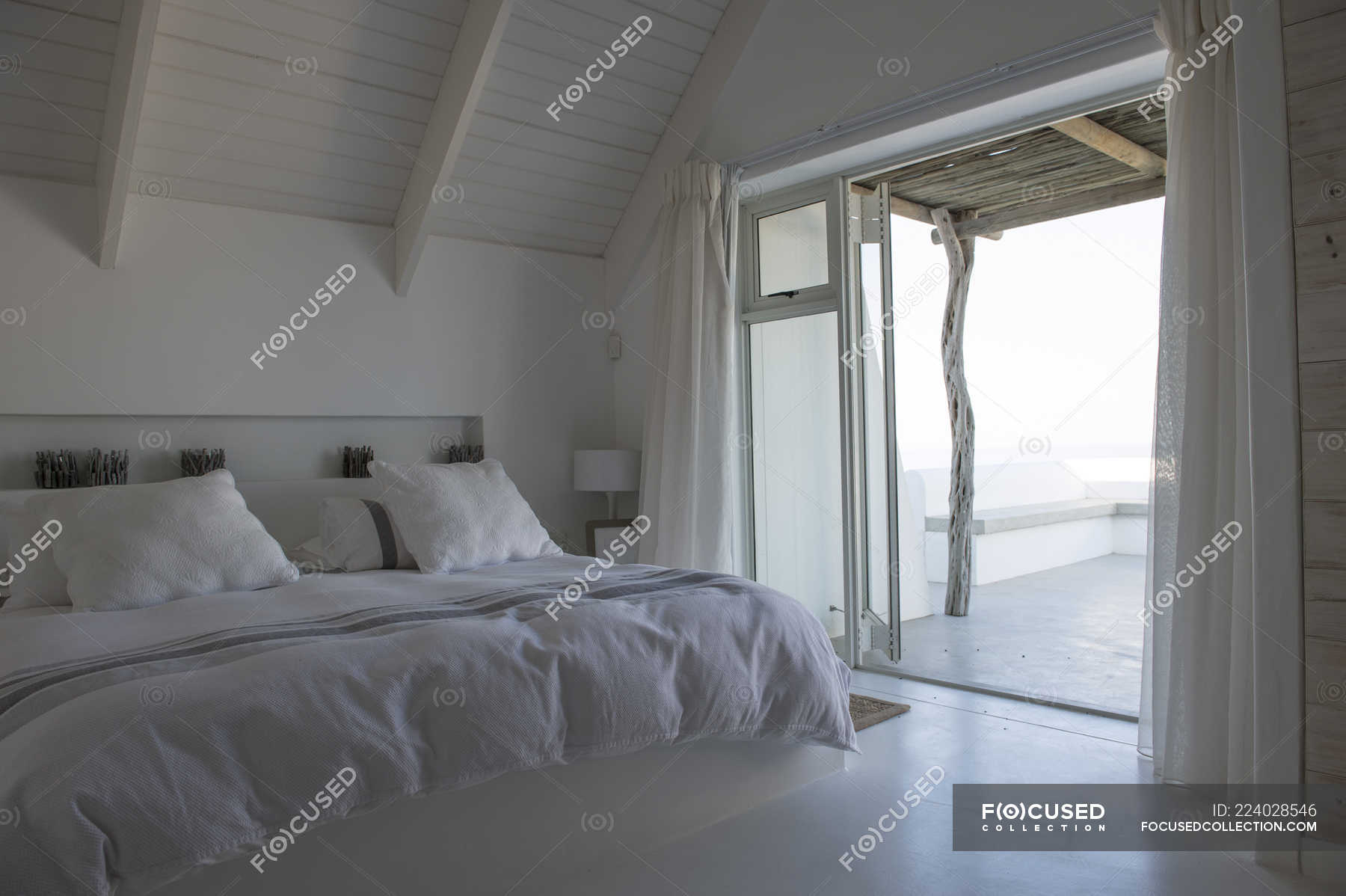 Interior Of Cozy White Bedroom In Modern House Home