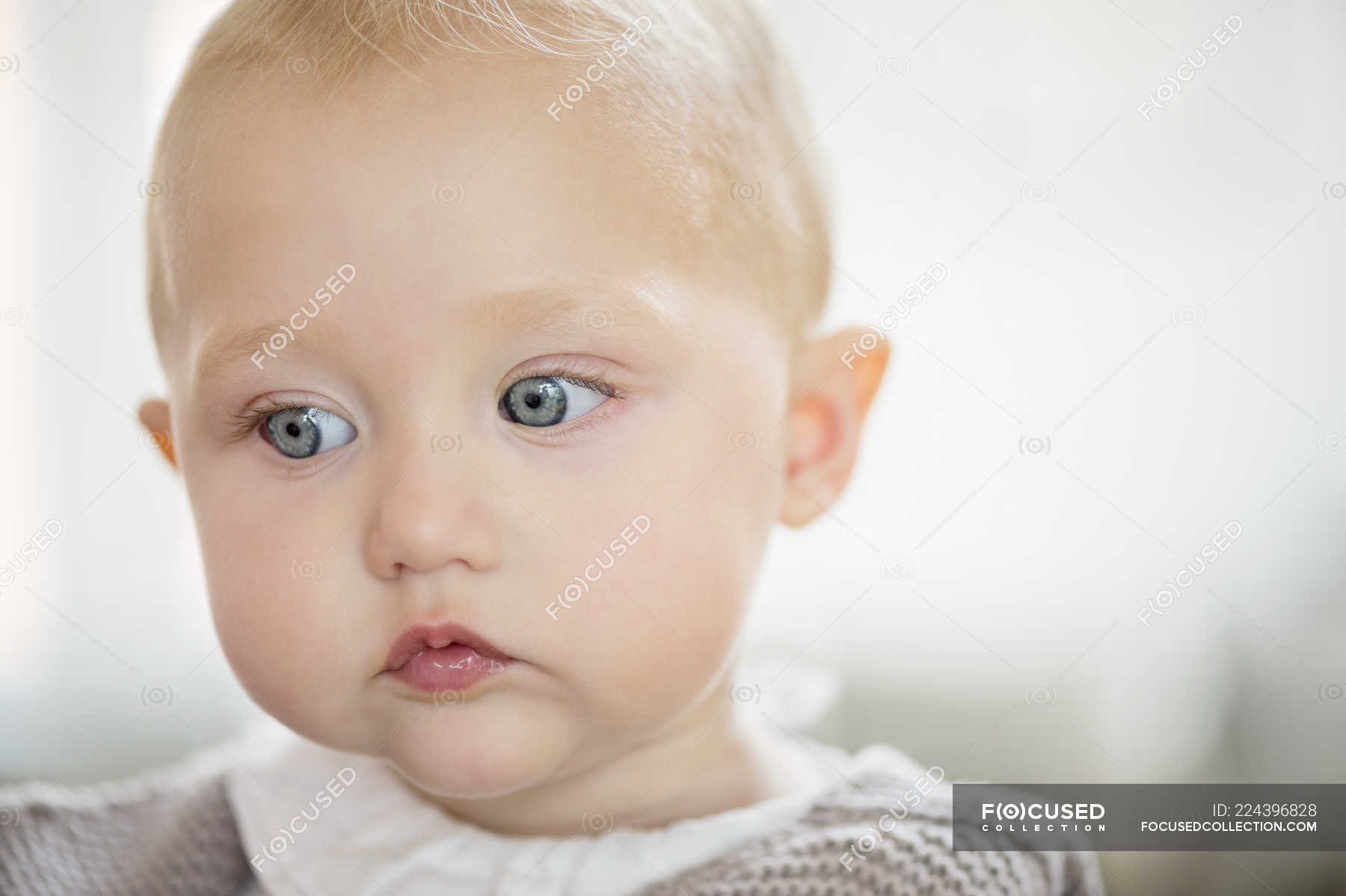 Close-up of thoughtful baby girl looking away — childhood, close up ...