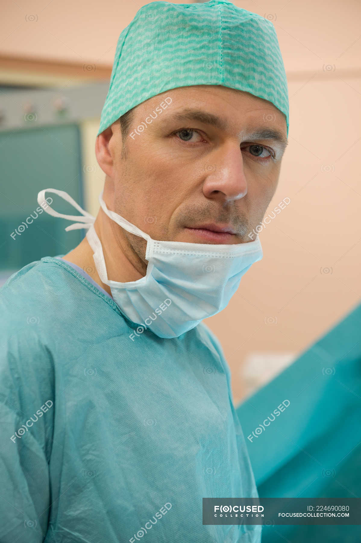 male-surgeon-standing-in-operating-room-clothes-indoors-stock