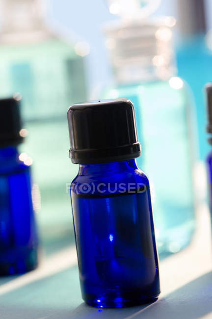 Close-up of blue essential oil bottles — Stock Photo