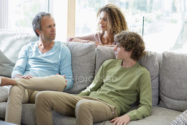 Happy family spending time together in living room at home — Stock Photo