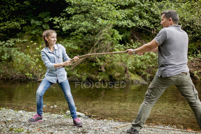 Father and daughter playing in a park — Stock Photo