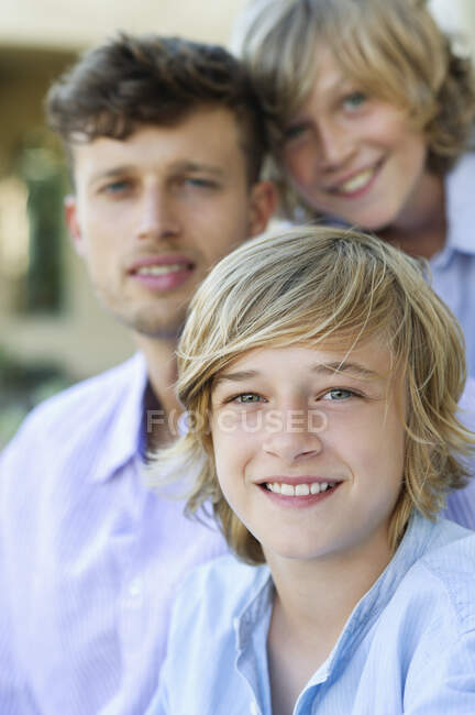 Portrait of children and a man — Stock Photo