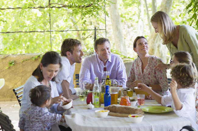 Multi generation family eating food at house — Stock Photo