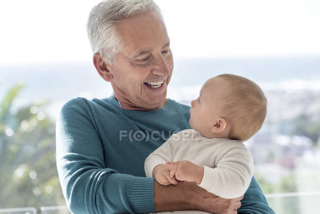 Happy grandfather with baby granddaughter — Stock Photo