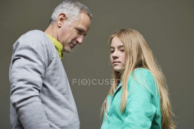 Man frowning on his daughter looking sad — Stock Photo