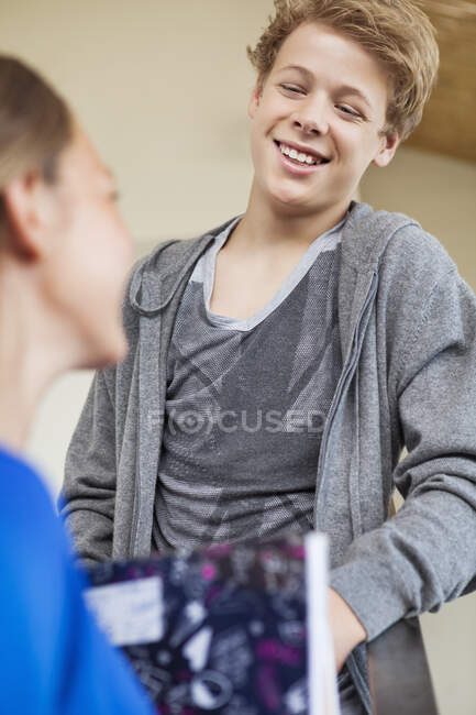 Students talking to each other in a school — Stock Photo