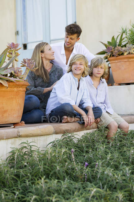 Portrait of happy family having fun on backyard — Stock Photo