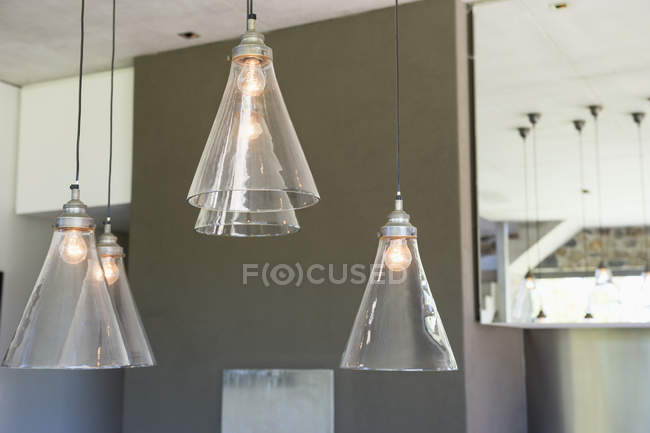 Electric lamps lit up in modern apartment — Stock Photo