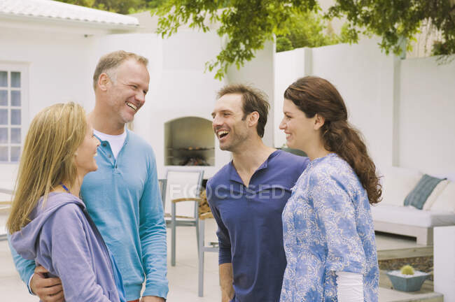 Two couples smiling together — Stock Photo