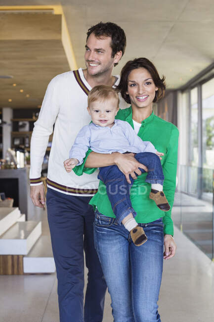Parents smiling with their son at home — Stock Photo