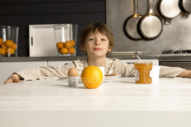 Portrait of a boy having breakfast — Stock Photo